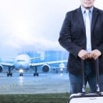 Travel insurance Young Man Luggage Staning In Front Of Air Plane