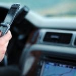 Distracted Drivers Pay More for Auto Insurance - Driver texting