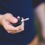 California auto insurance rates - man holding car key