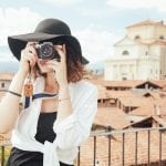 International Travel Insurance - Woman tourist taking photos