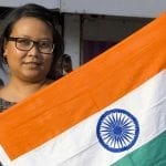 Indian health insurance - Woman holding Indian Flag