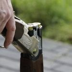 NRA branded insurance - Man holding shotgun