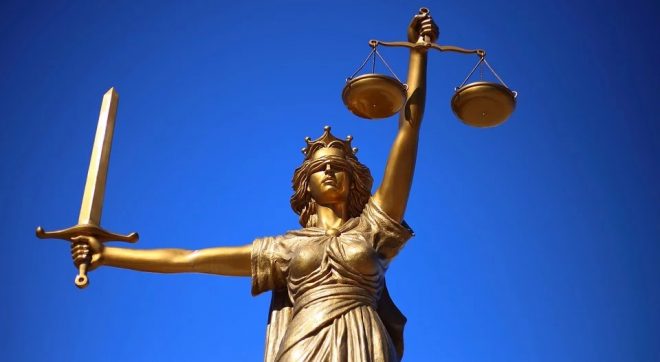 Proof of health insurance - Lady Justice