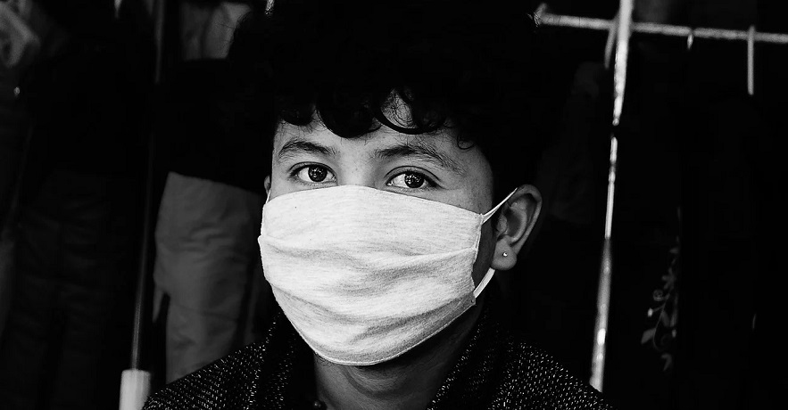 Travel insurance covers coronavirus - Person wearing mask