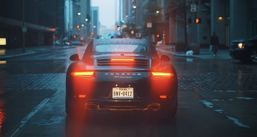 Progressive auto insurance - Porsche car with break lights on