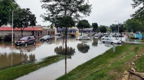 Increasing flood insurance rates - Flooding in neighborhood - shops & cars