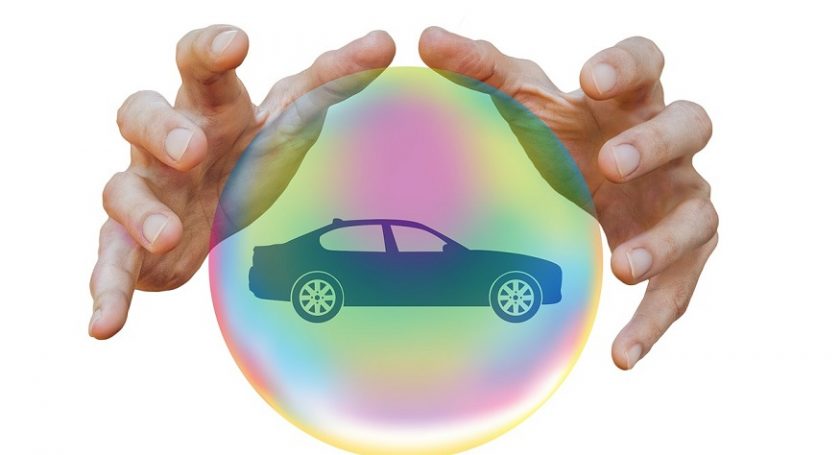 Auto insurance companies - hands - car in bubble
