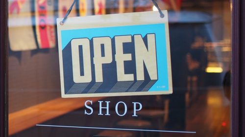 Business Owners Insurance - Open sign on shop door