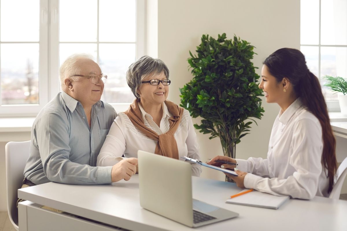 Silent Generation - Couple talking with a business person