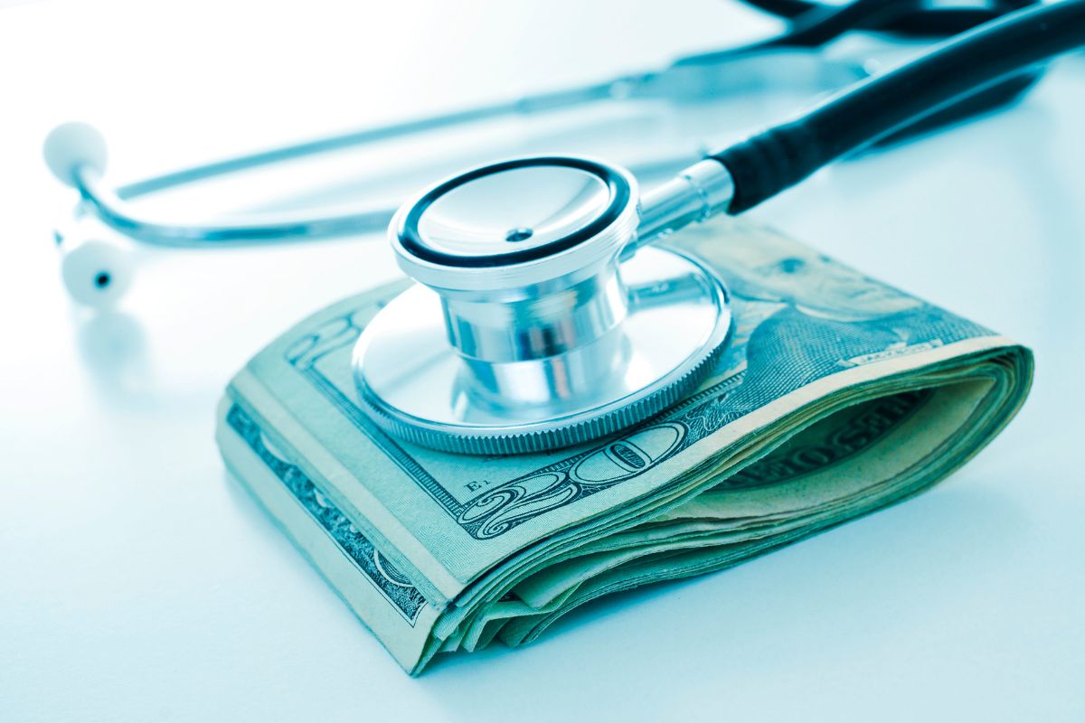 Health care - stethoscope on folded bills