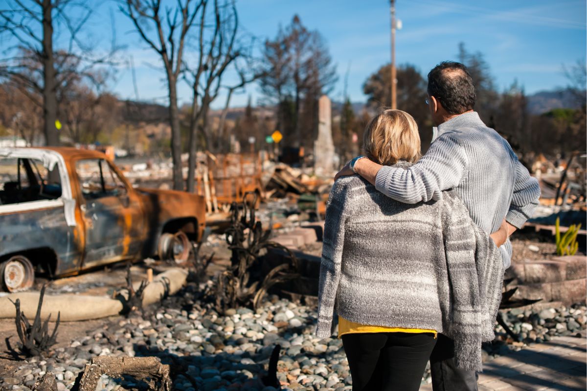 Wildfire insurance - People Looking at Loss after fire