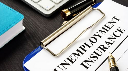 Unemployment Insurance form with pen
