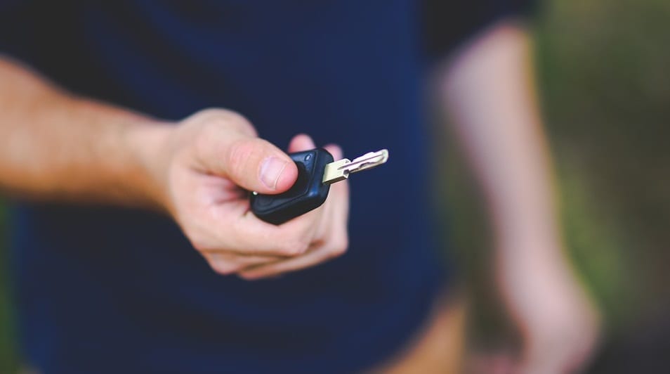 California auto insurance rates - man holding car key