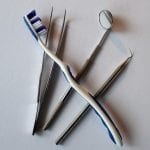 Dental Insurance Company - Toothbrush and Dental Tools