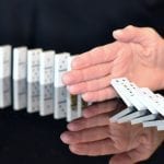 US Healthcare Groups - Opposed to Changes - Hand stopping dominoes