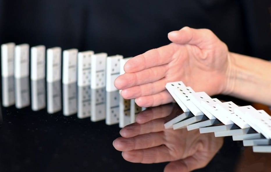 US Healthcare Groups - Opposed to Changes - Hand stopping dominoes