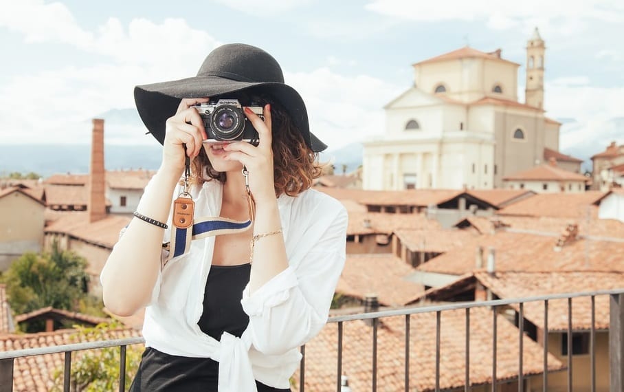 International Travel Insurance - Woman tourist taking photos