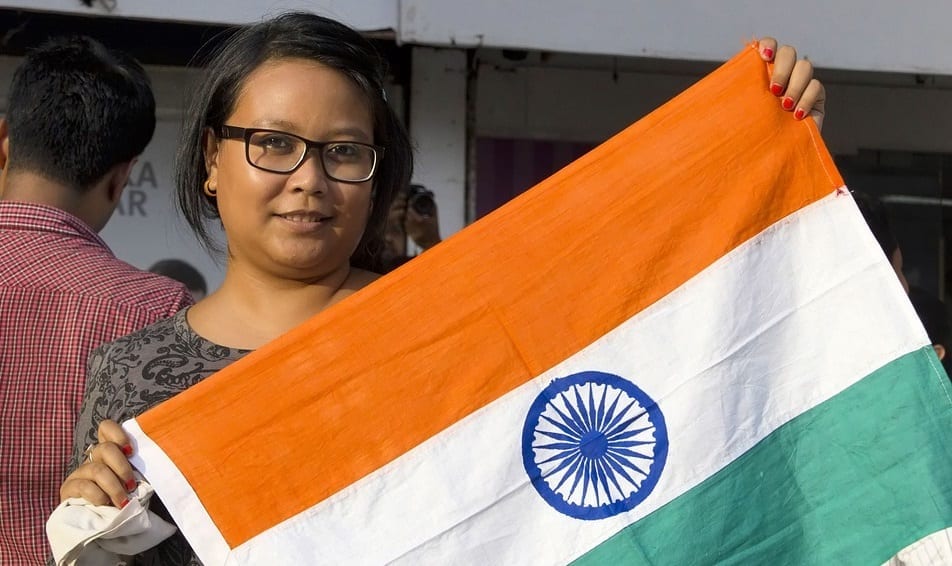 Indian health insurance - Woman holding Indian Flag