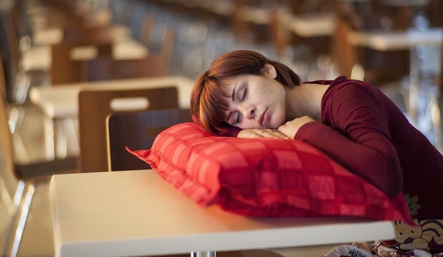 Daylight Saving Time - woman sleeping on table