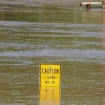 Buy Flood Insurance - Flood Waters - Caution sign