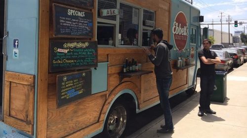 Food Truck Insurance - Man ordering from food truck