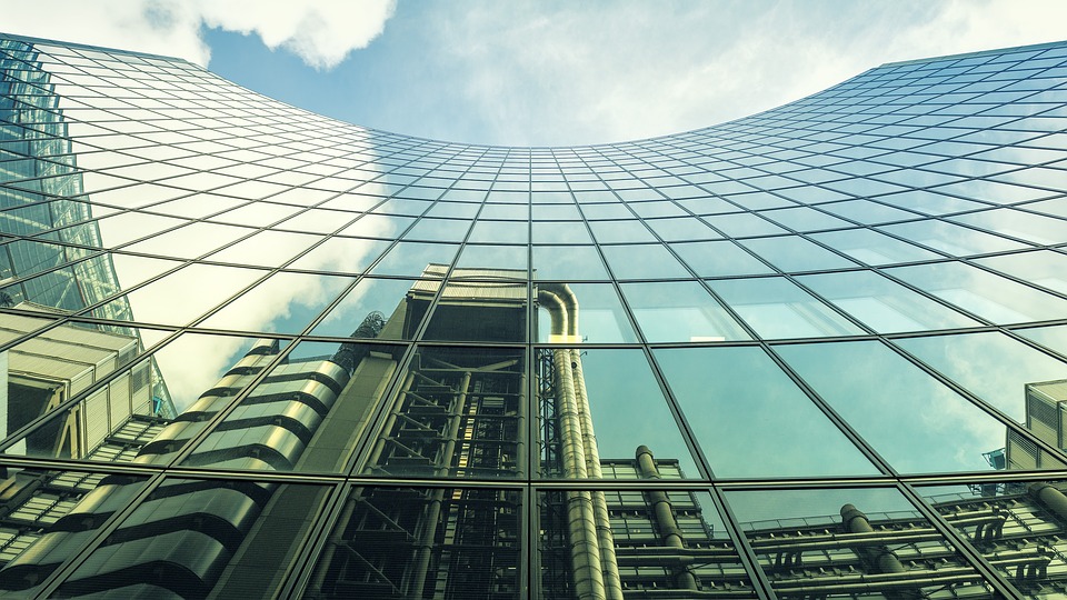 Insurance contracts - Lloyd's of London building reflected in glass