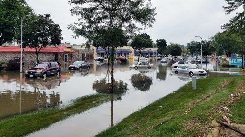 Increasing flood insurance rates - Flooding in neighborhood - shops & cars