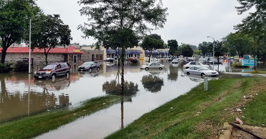 Increasing flood insurance rates - Flooding in neighborhood - shops & cars