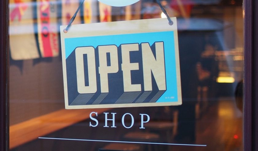 Small business insurance market - Open Sign on Shop Door