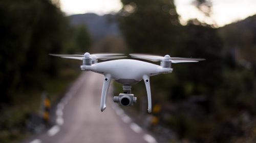 Insurance drones - drone flying over road