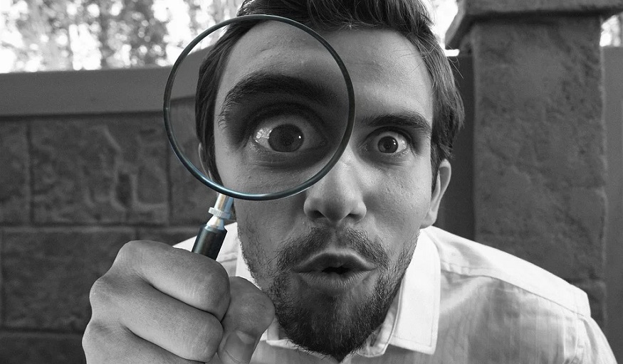 DIY home inspections - person using magnifying glass