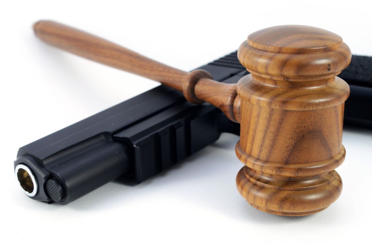 Gun insurance - firearm and judge gavel