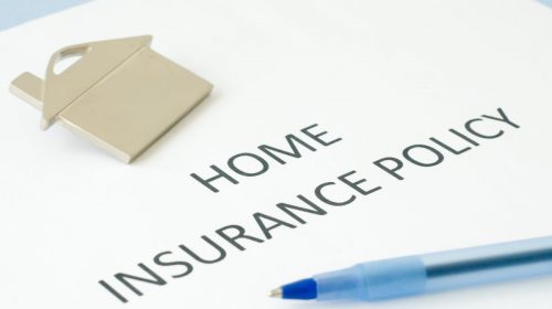 Home insurance policy - paper with pen