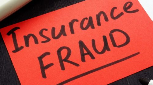 Insurance Fraud - Paper with words written