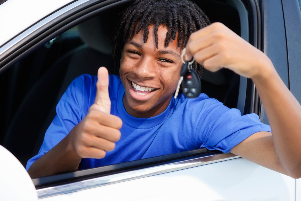 Auto Insurance - Teen holding keys in car