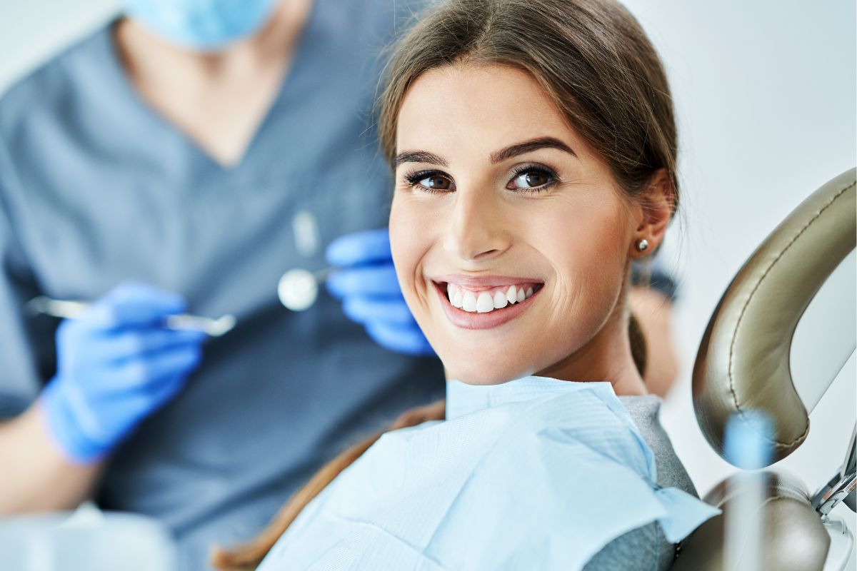 Dental insurance - Woman smiling in dentist office