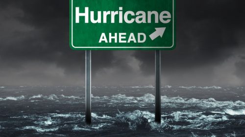 Hurricane insurance - Hurricane Ahead Sign in water
