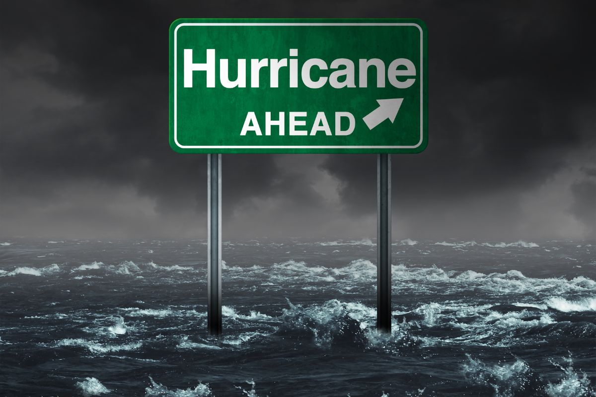 Hurricane insurance - Hurricane Ahead Sign in water