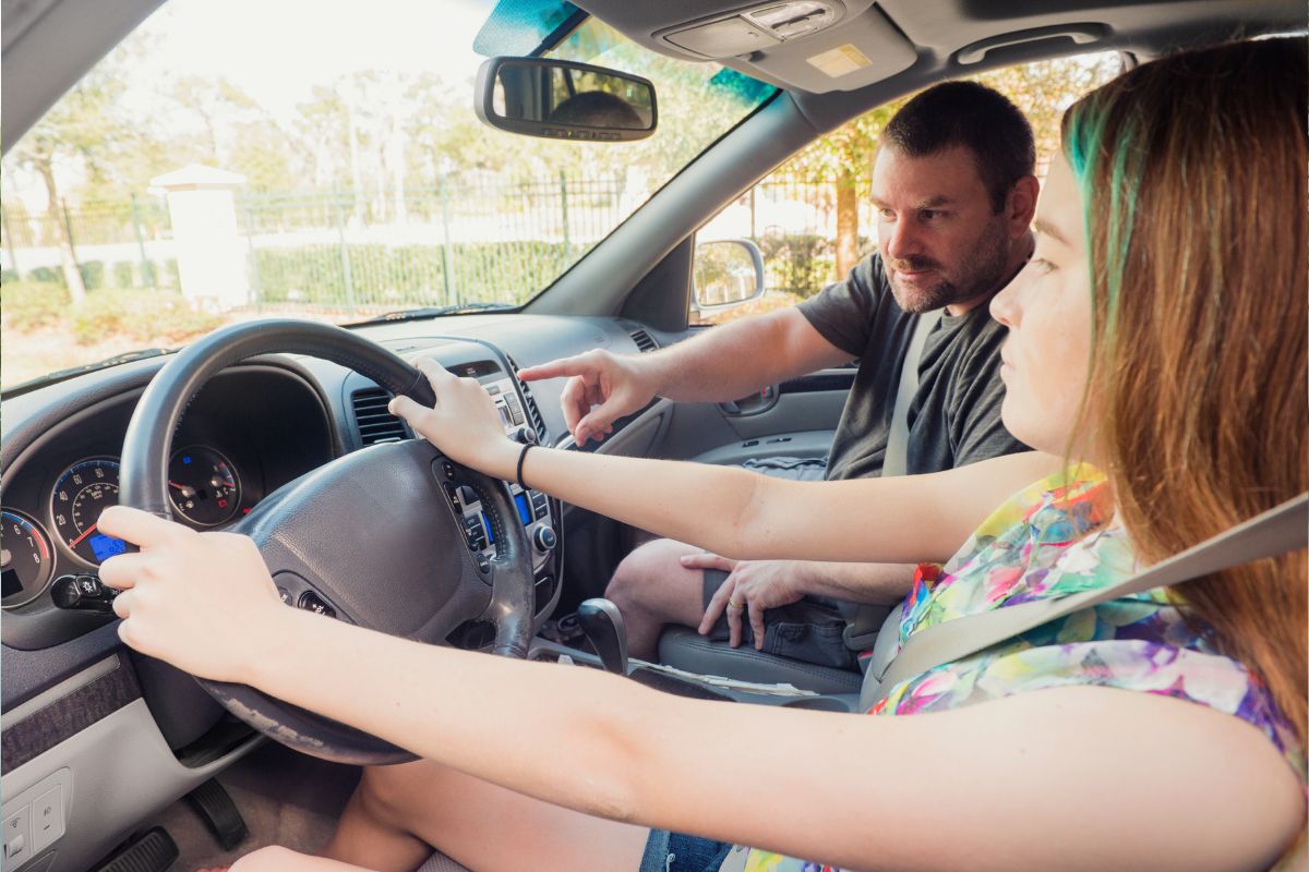 Teen Driver Awareness Month - Teen in car with parent