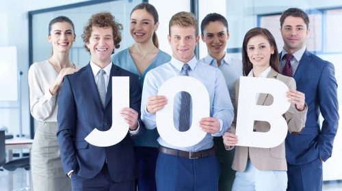 Insurance jobs - People holding up letters