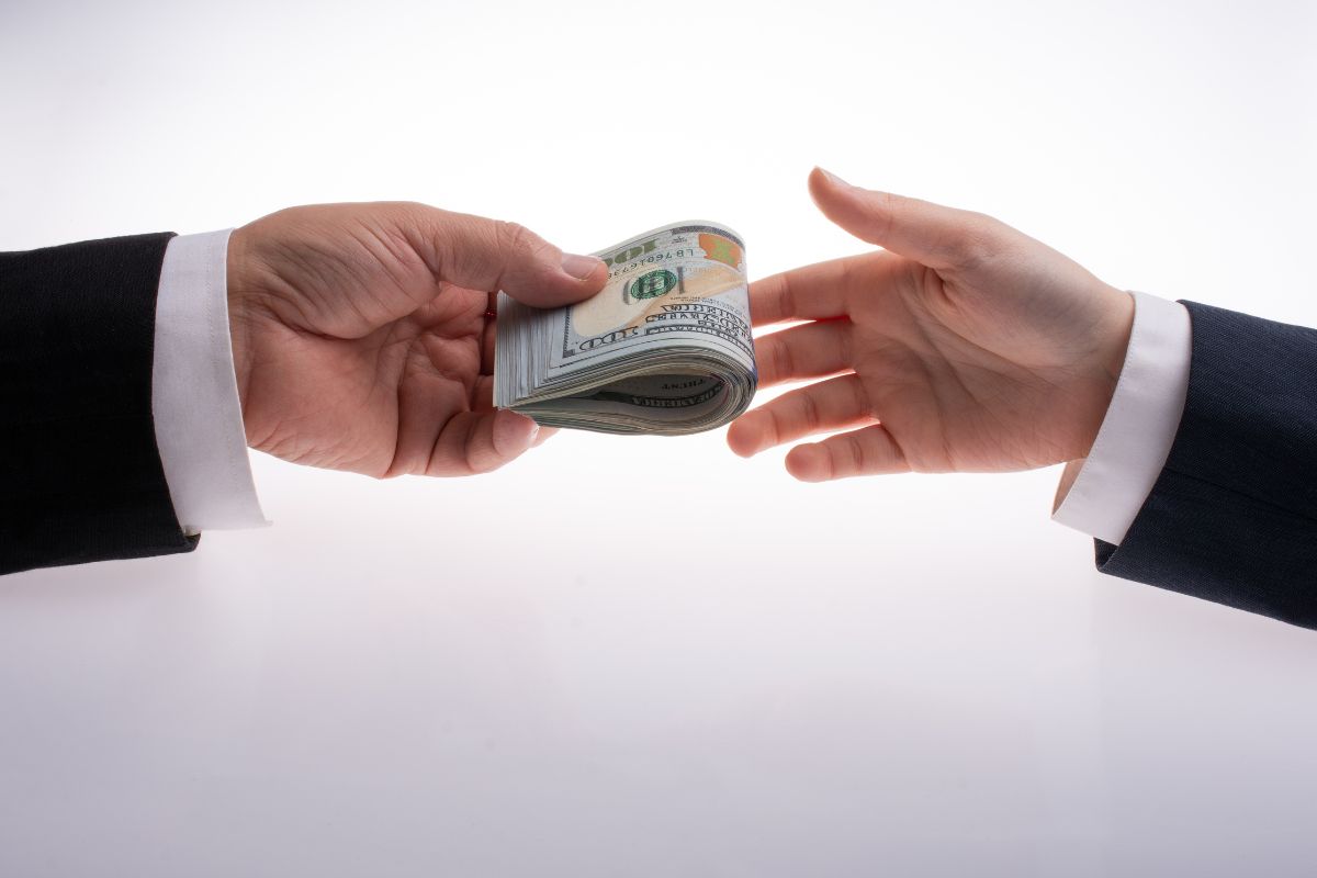 Insurtech company - Hands exchanging money