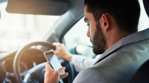 Distracted driving - Person using phone while driving