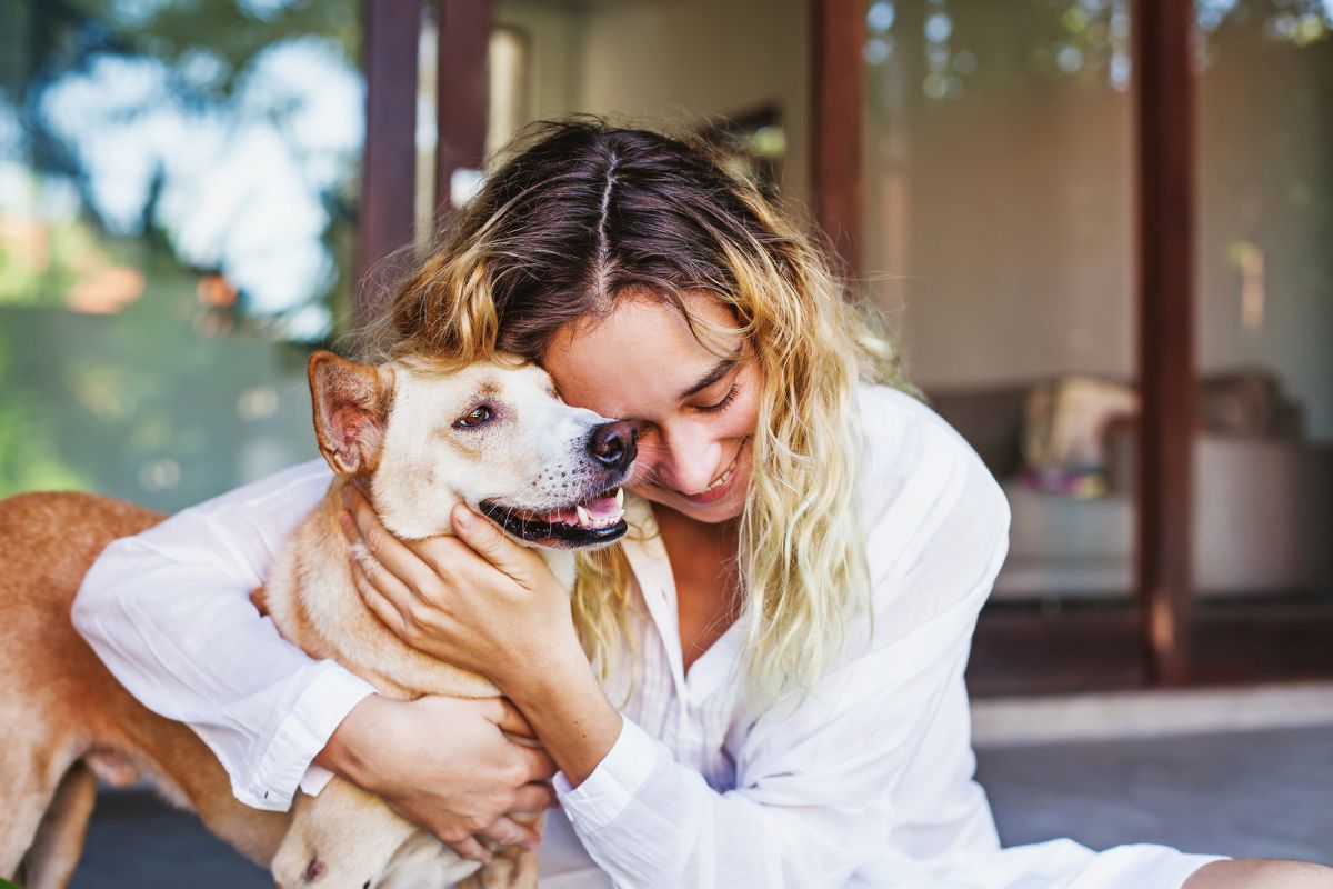Pet Insurance - Person hugging pet