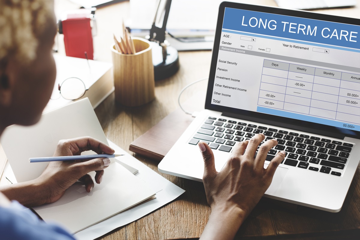 Depositphotos - Woman on computer looking up long term care insurance