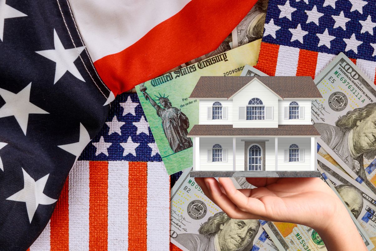 Homeowners insurance - American flag, money, person holding up house