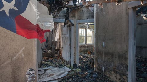 Home insurance - fire destruction inside home- Texas flag